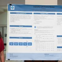 Biostatistics graduate student, Emma Boven, standing in front of his poster.